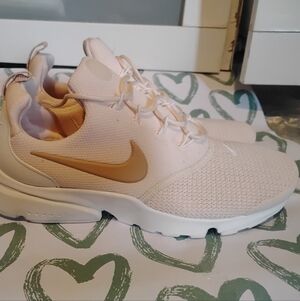 Nike Women's Pale Pink Athletic Slip-On Sneakers with Gold Swoosh